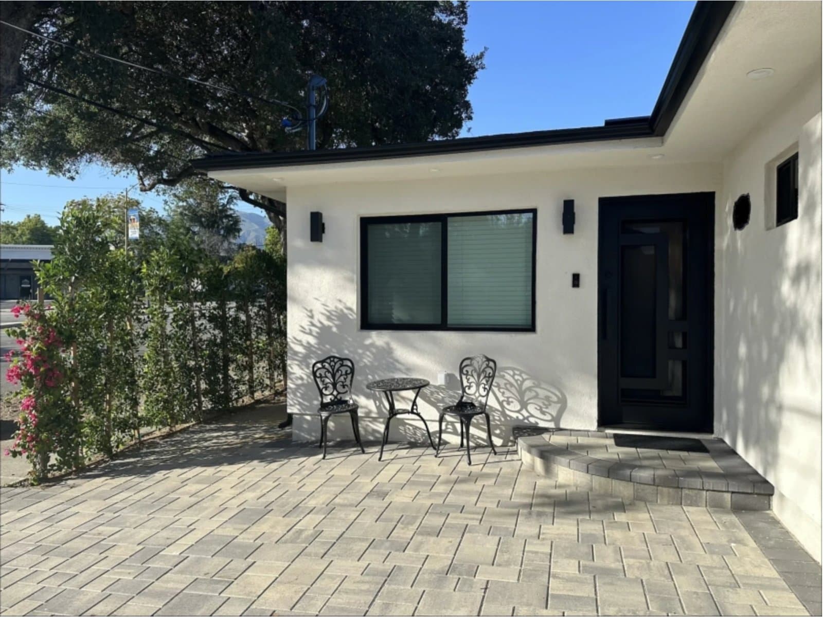 Completed ADU conversion with paver patio, bougainvillea and a private entrance